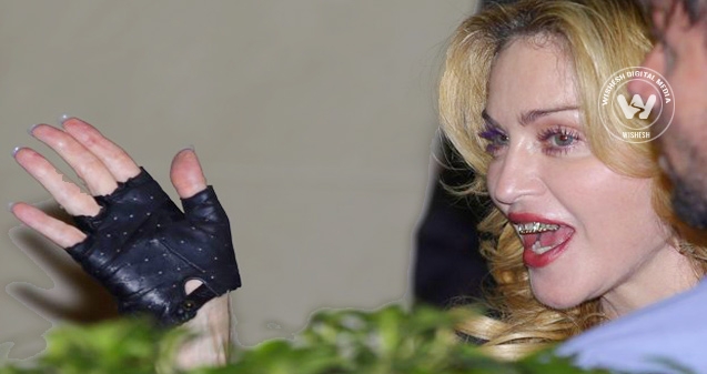 What's Madonna hiding behind that smirk?},{What's Madonna hiding behind that smirk?