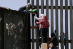 punjabis crossing US mexico border, punjabis crossing US mexico border, video clip shows punjabi women children crossing border fence into u s, Punjabis